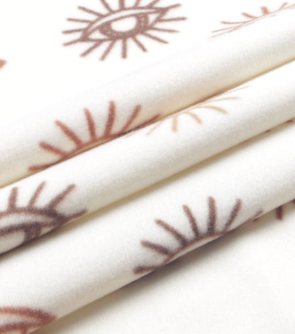Cream Eye Blizzard Prints Fleece Fabric