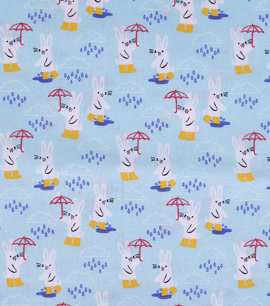 Bunnies In The Rain on Blue Novelty Cotton Fabric